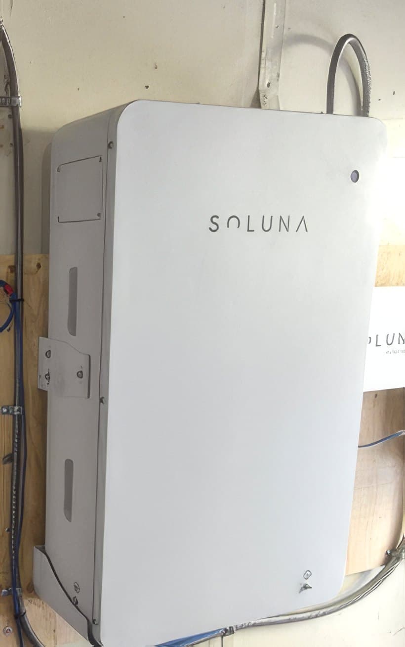 A Soluna lithium battery cabinet mounted on a wall, wired into the home's solar system